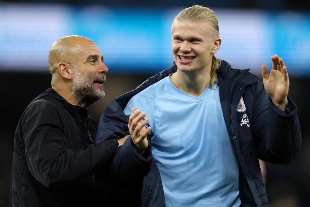 Guardiola e Haaland sorridenti